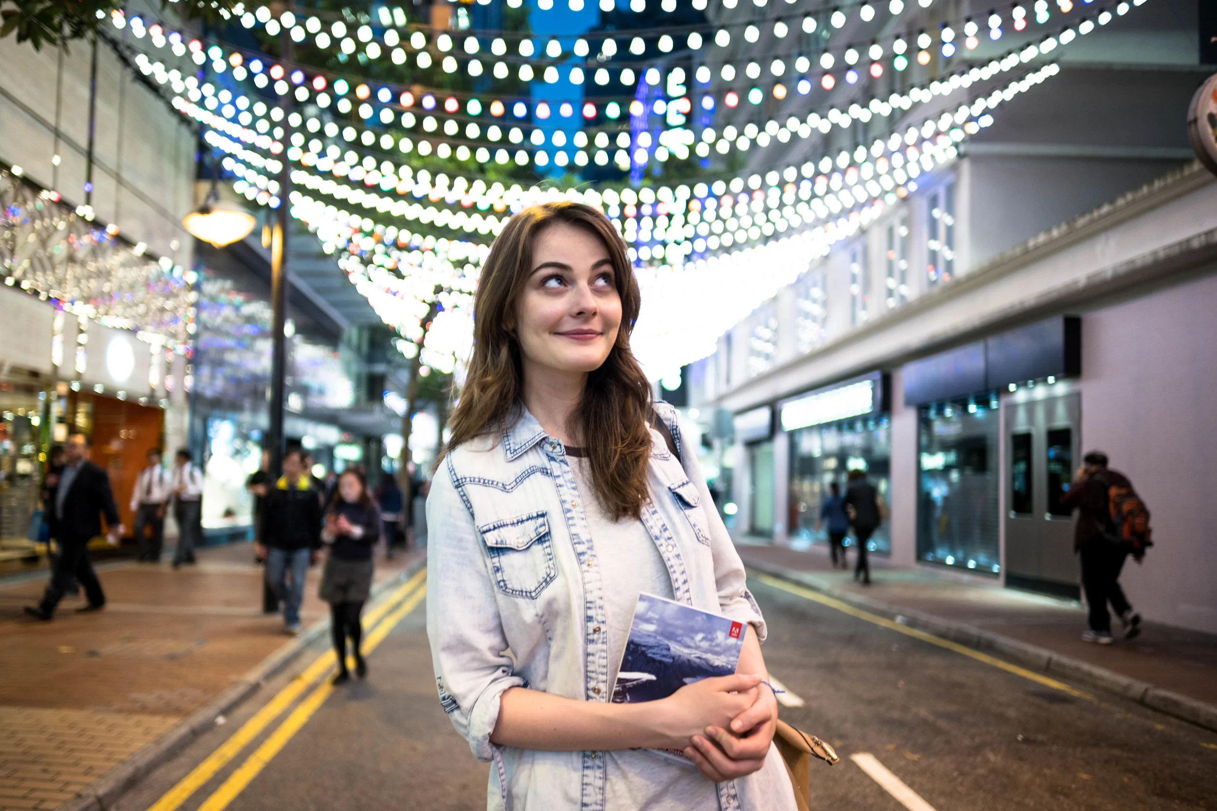 Anna basking in the delight with her discovery of Lightroom 6 in hand, underneath the festive lighting of the season.