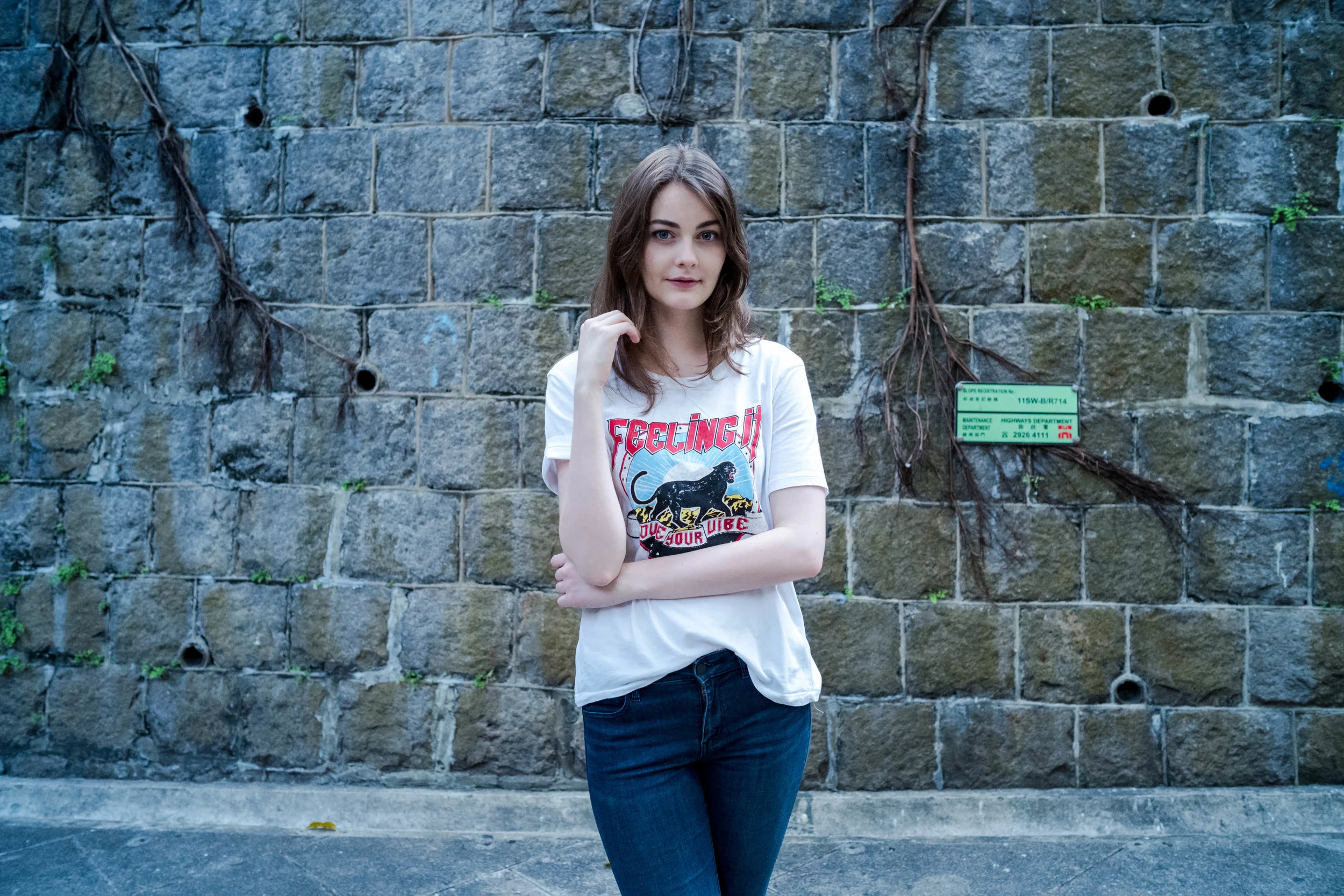28 Lux, f/5.6 - Anna in front of a stone wall.