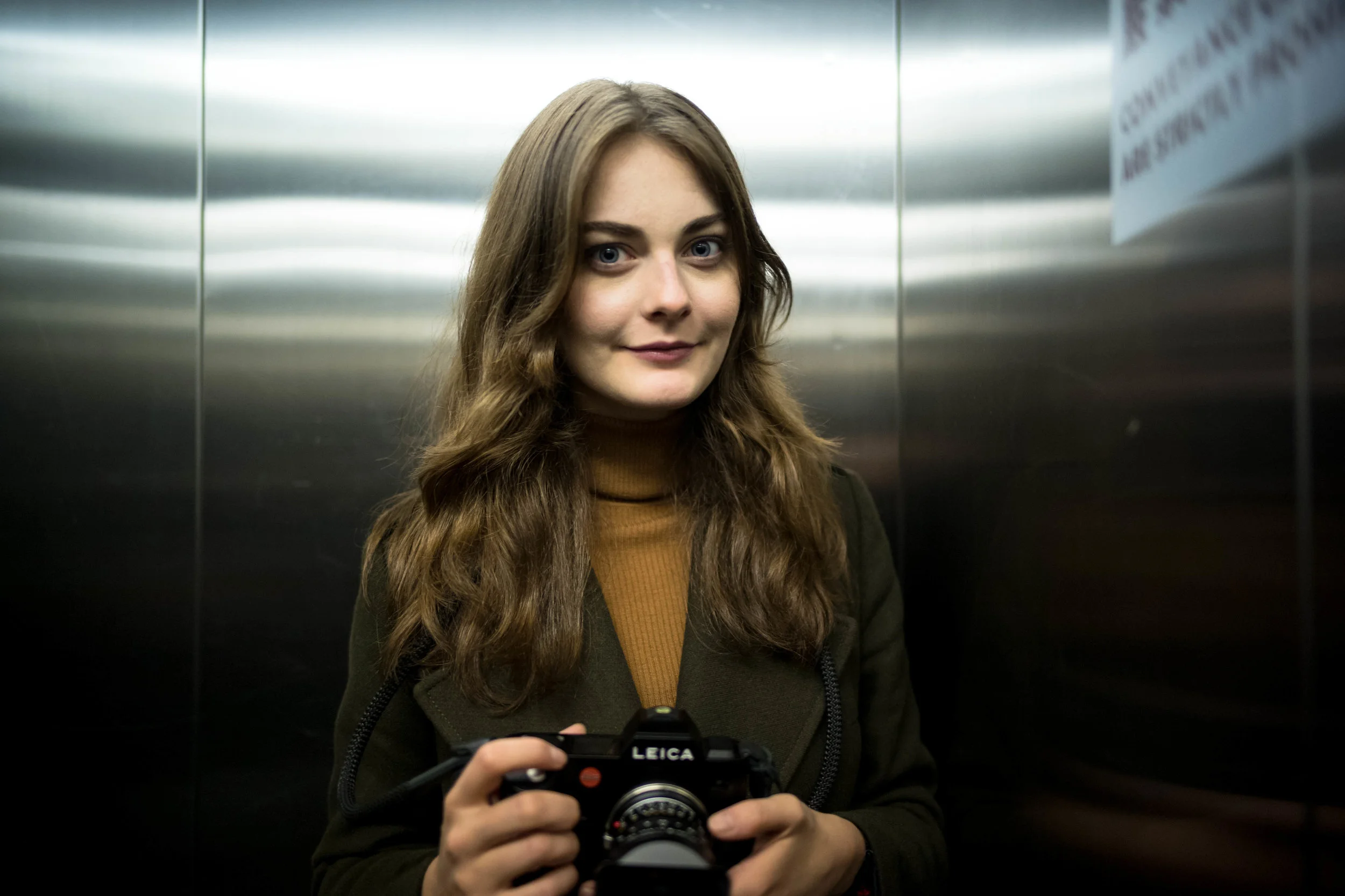 Inside a dark elevator. f/1.4
