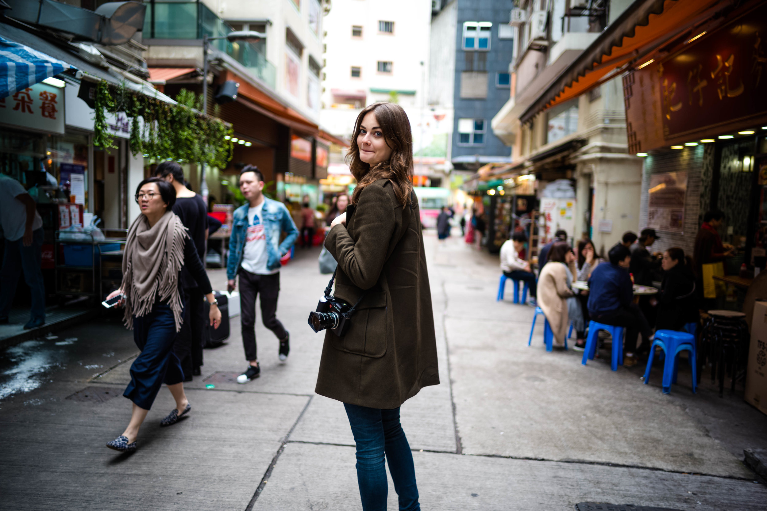 Emerging from an alley. f/1.4