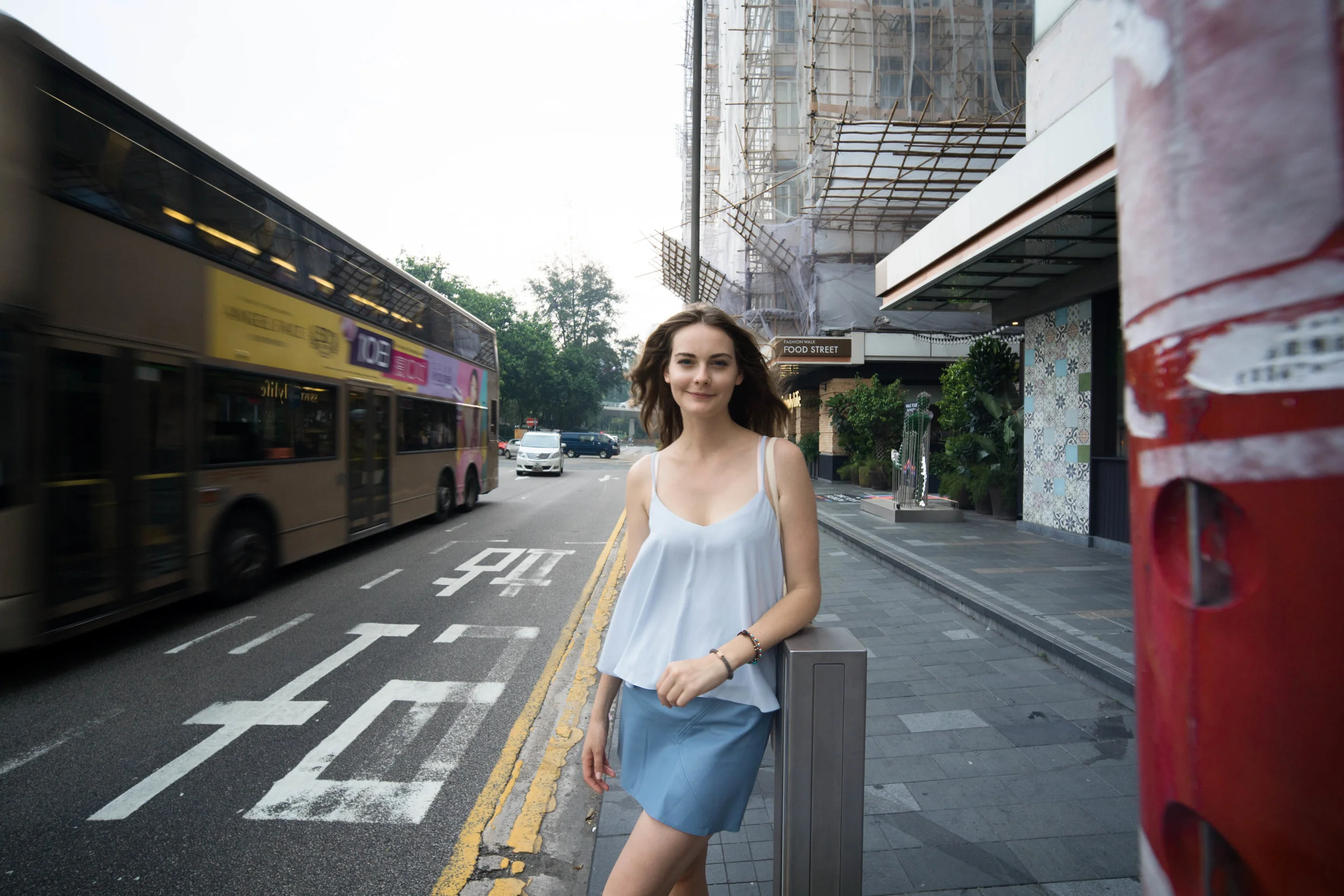 Playing with an object in a focal plane closer than Anna. Distortion is minimized on face, while elongated for the torso. Notice the distortion on the bus.