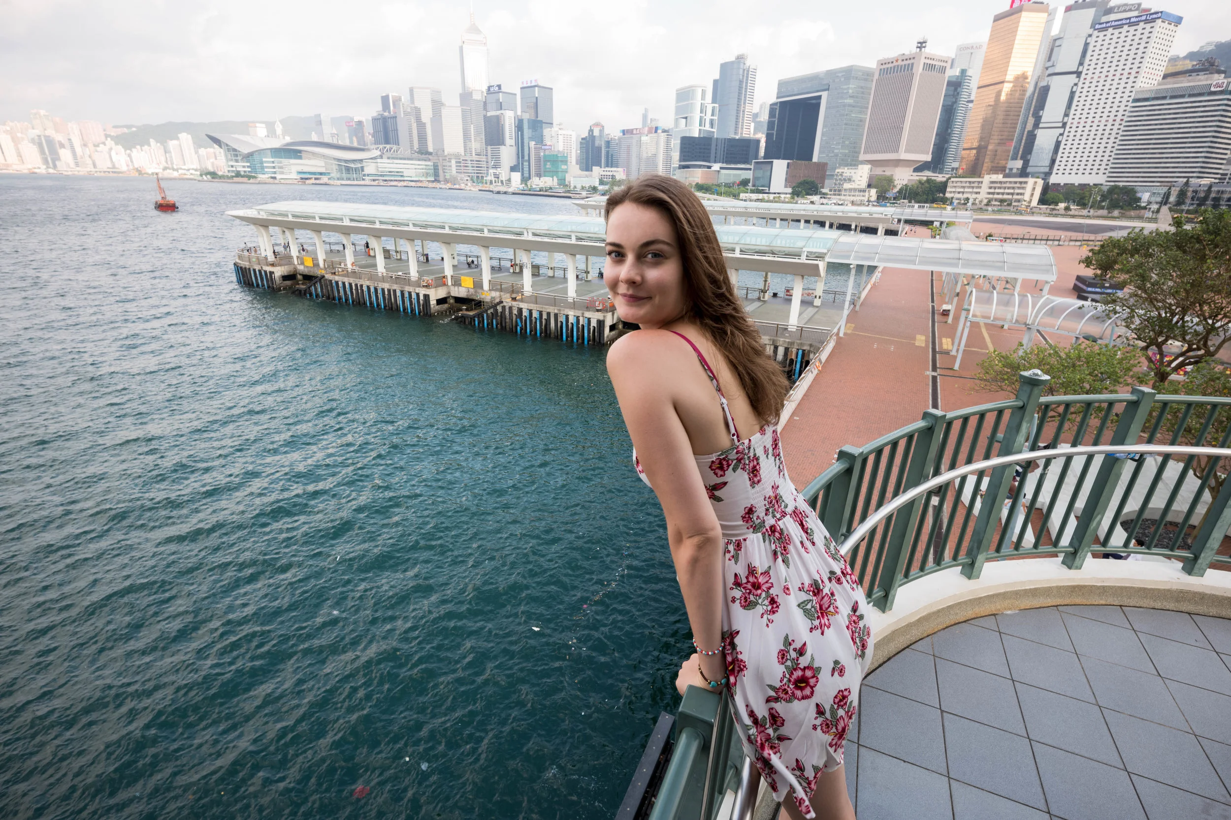 Playing with distortion. I asked Anna to lean slightly over the railing (without falling over) in order to center her head in the frame (to minimize distortion), while positioning her torso to the right, in order to have more water covering the composition than promenade.