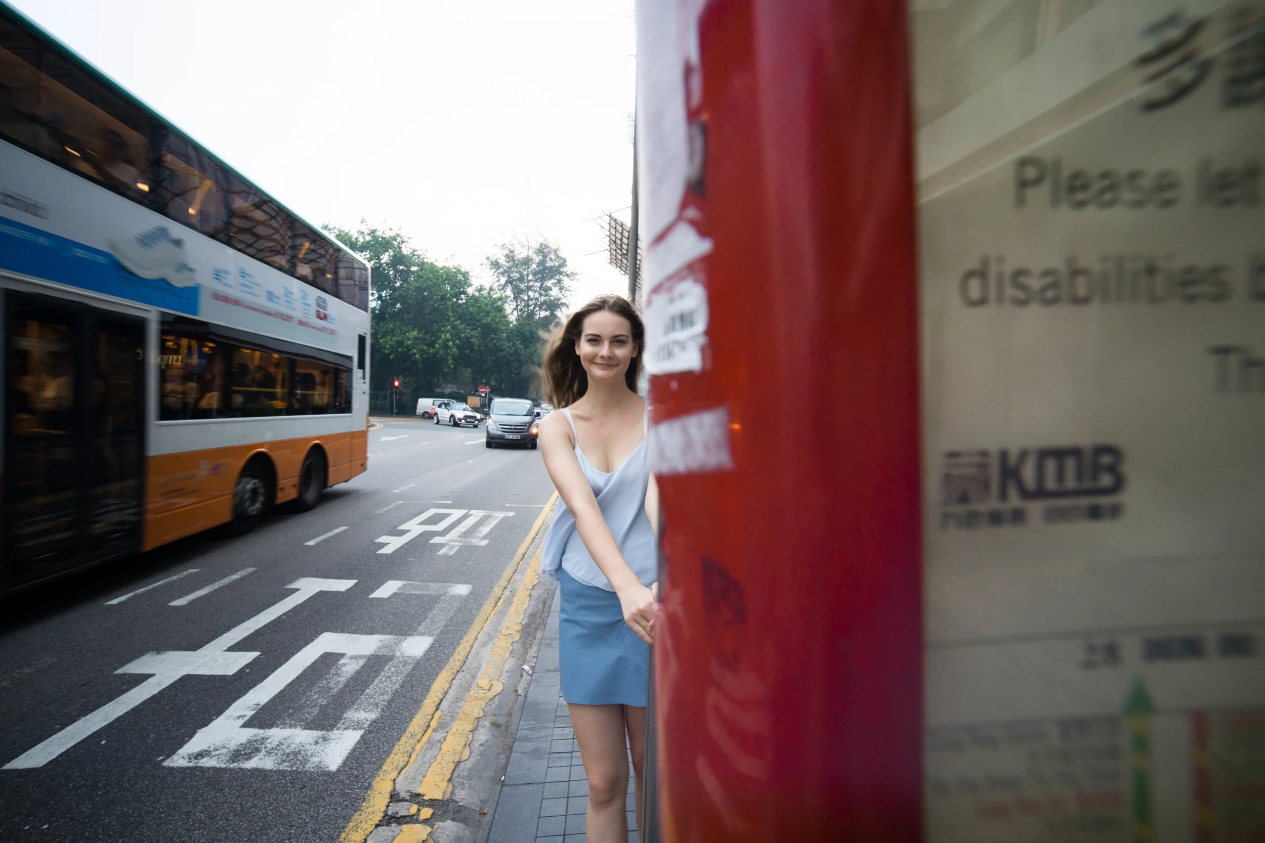 Greater emphasis on the object on the closer focal plane. Again, distortion is minimized while elongated for the torso. Also notice the distortion of the bus.