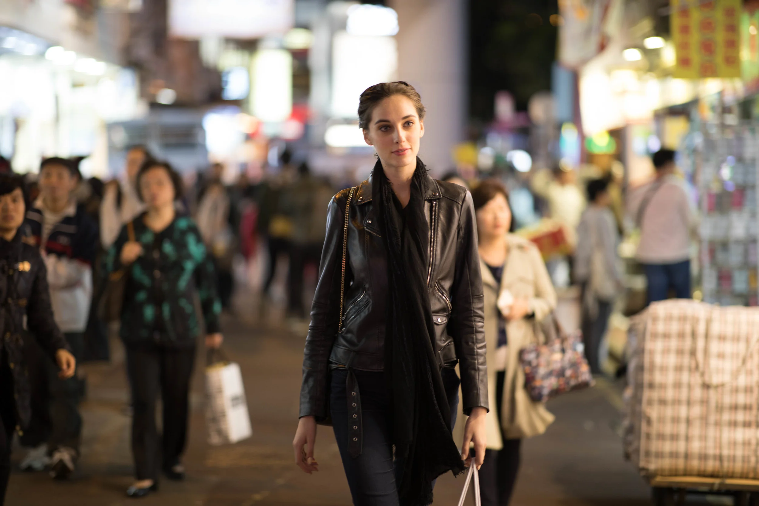 ISO 400, f/1.4, 1/200s. Beyond 15' (roughly 4-5 meters), bokeh becomes less apparent. However subject isolation is still noticeably well rendered. Getting tack focus of a moving subject is also noticeably more challenging.