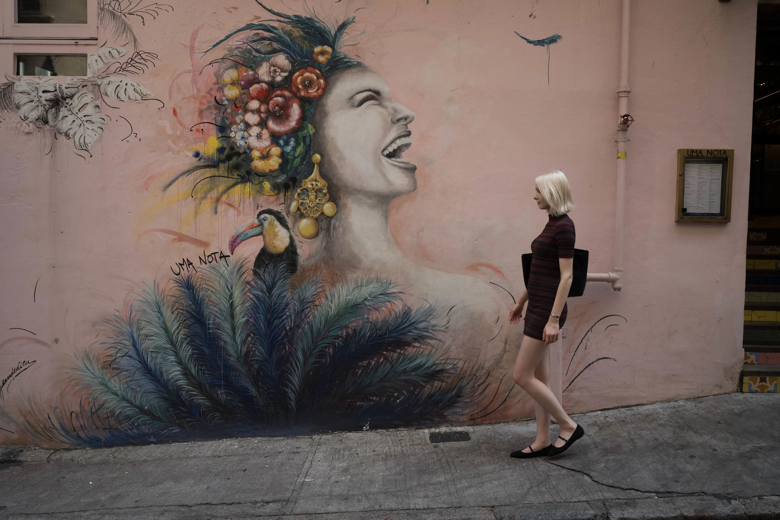 Judit wanted a picture of herself with this mural.