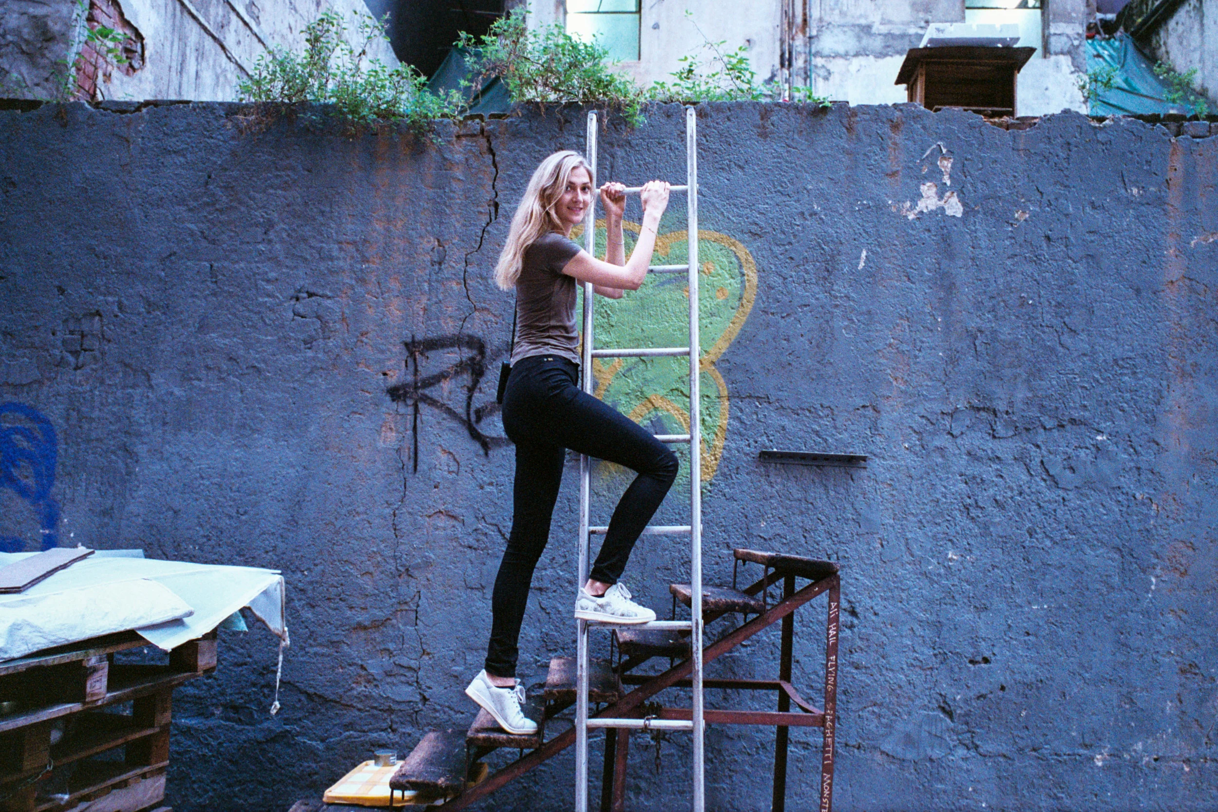 Fujifilm Superia Venus 800 @ 35mm Focal Length - Interacting with the environment by climbing up a ladder. Compositional variables include texture and color on the wall.