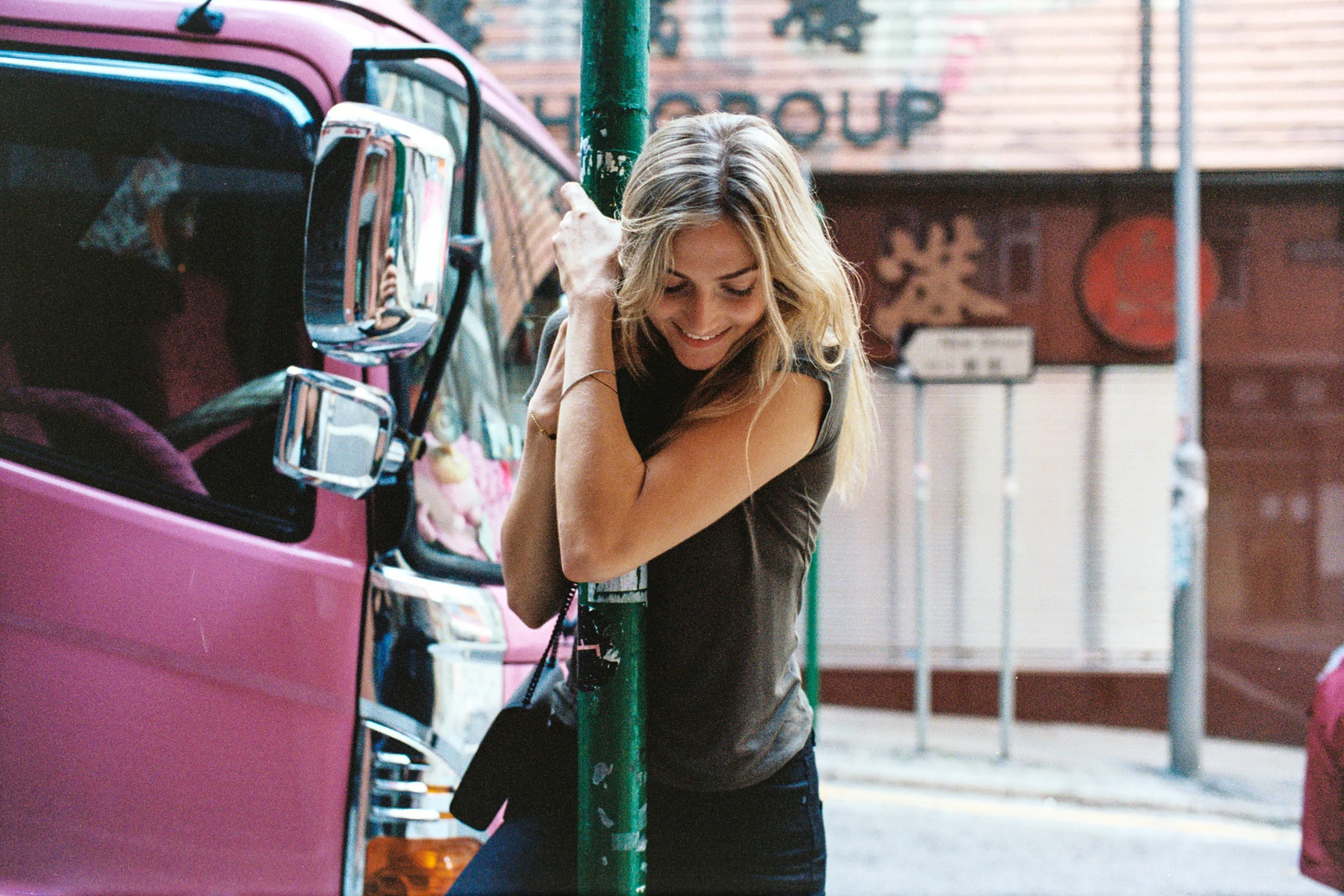 Kodak Portra 400 @ 35mm Focal Length - Interacting with the environment by hanging on a pole.