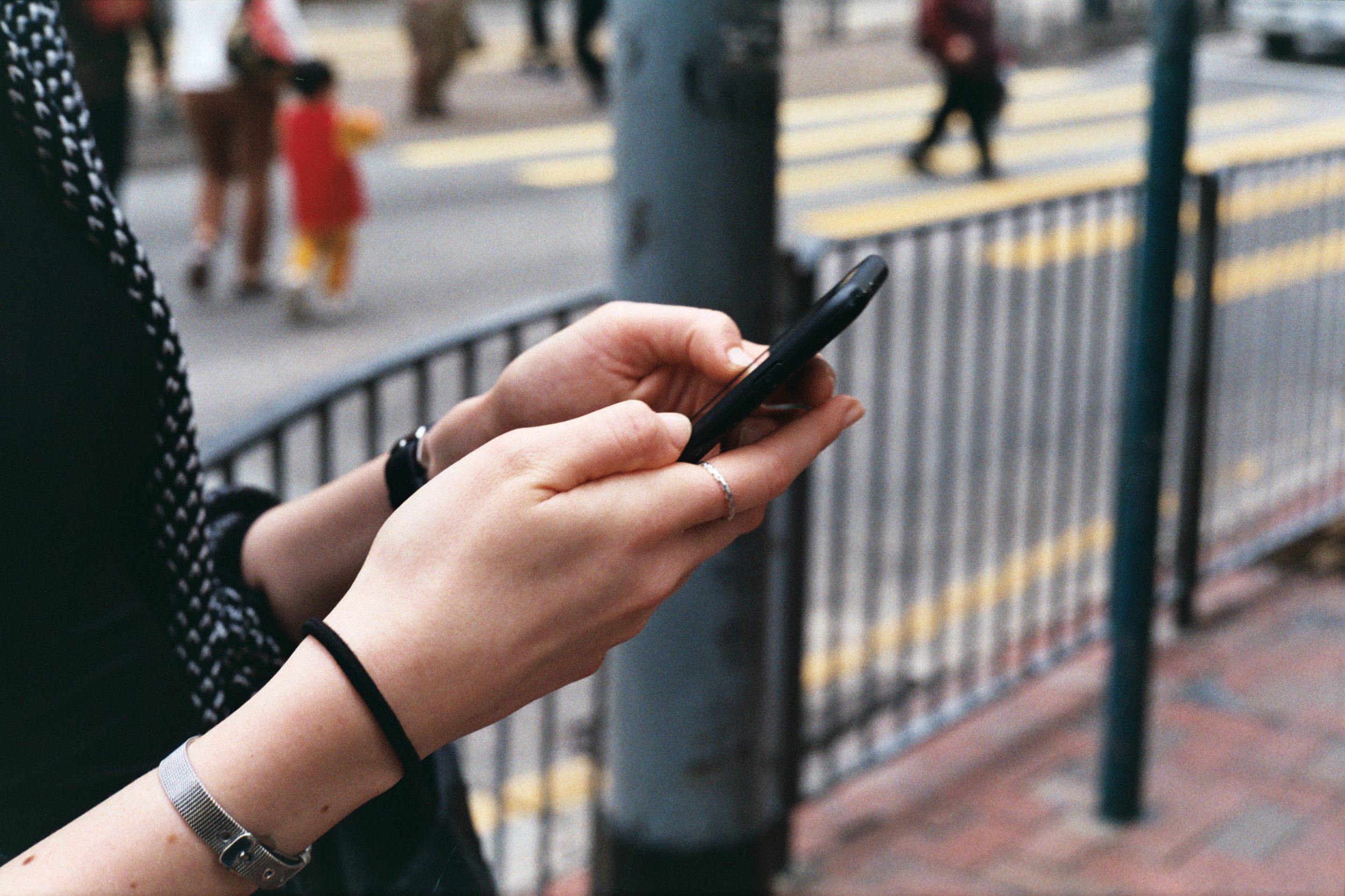 Leica MP-6 + Leica 50mm f/2 Summicron-M + Agfa Vista 200 - Checking Google Maps after seeing many passersby with bubble tea.