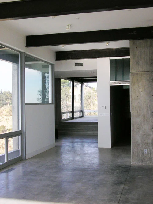 view from living room to dining and kitchen