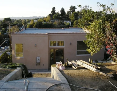 view of back patio from the guest house — during renovation