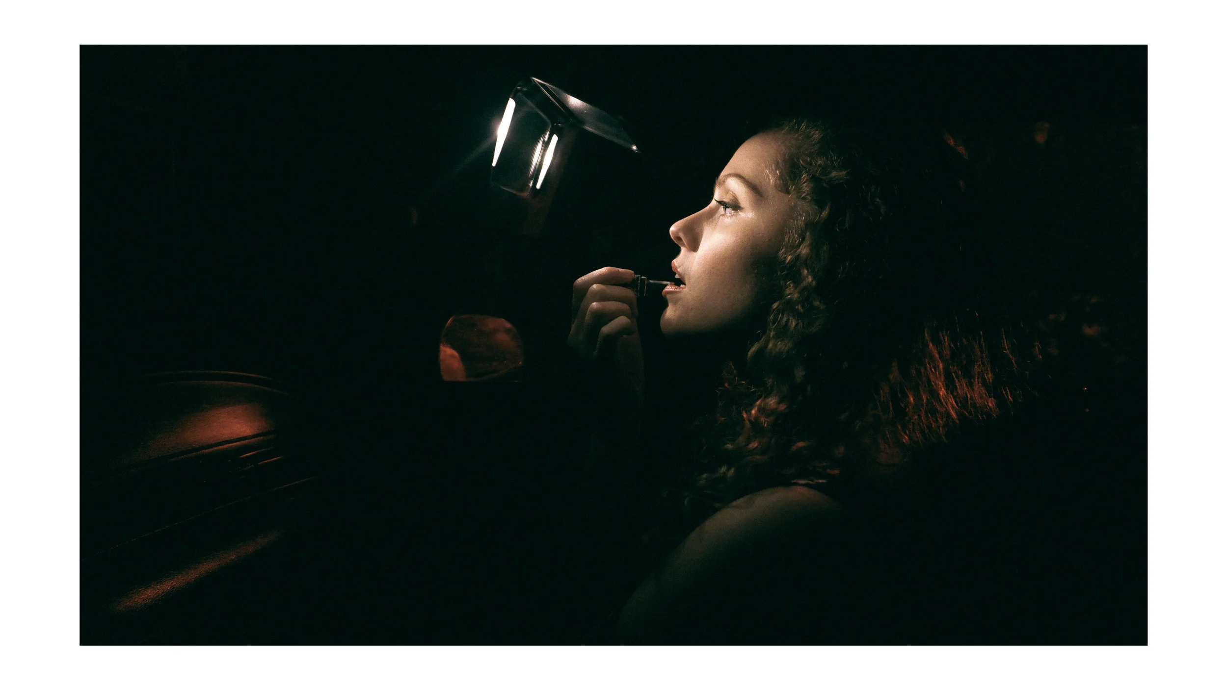 Makeup touch-ups in the car shoot