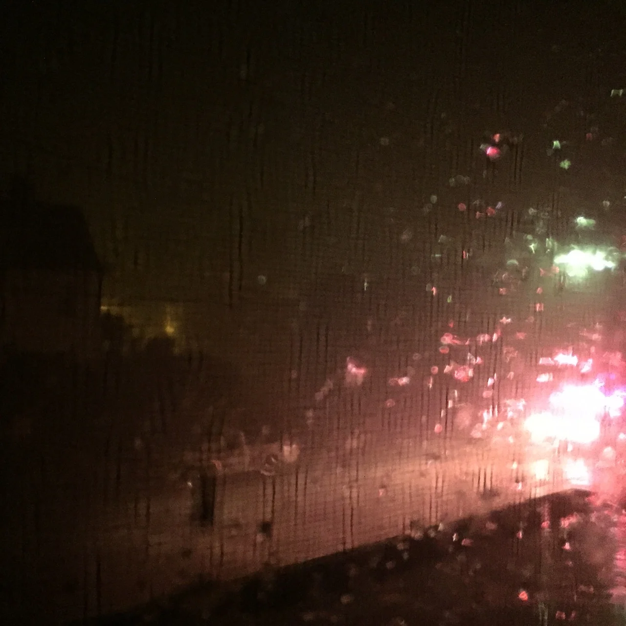 Watching First Responders drive down the street during the thunder and lightning storm. Photo Credit: Katie Hellmuth Martin