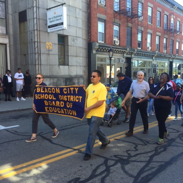 The Beacon City School District, with Meredith Heuer and Antony Tseng holding the banner, and Anthony White, William Zoph and Kenya Gadsen marching. Interim Superintendent Ann Marie Quartironi.