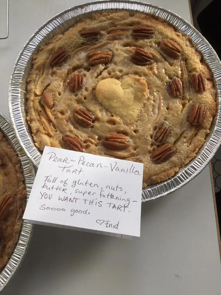 Citizen baker Enid Zentellis tempts donors with her Pear-Pecan-Vanilla-Tart. Photo credit: Beacon of Love's Facebook Page.