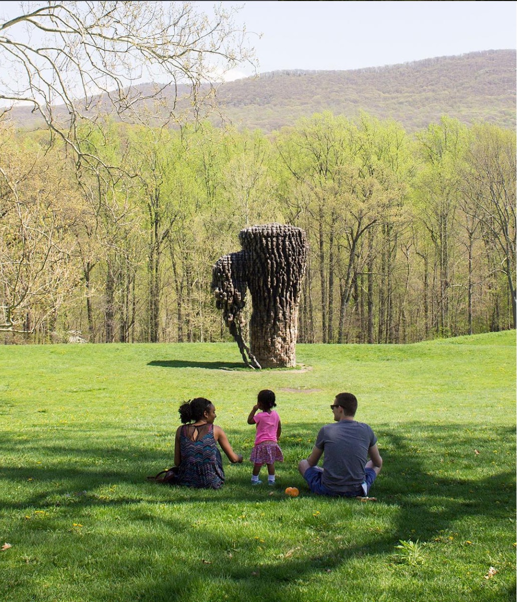 family looking at tree sculpture.jpg