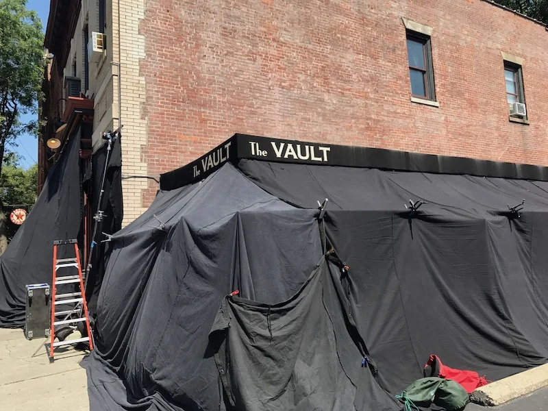 The Vault's patio is blacked out so that the production can control lighting for a scene being shot on the inside. Photo Credit: Bruno Barros