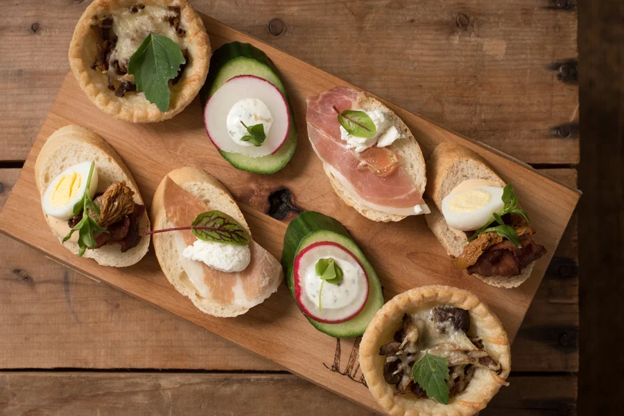 Quail egg, crispy bacon, pickled chanterelle, sumac aioli crostini. Prosciutto, goat cheese & dandelion bite. Cucumber, radish, wild sorrel and cream cheese bite. Wild mushroom gruyere tart.
