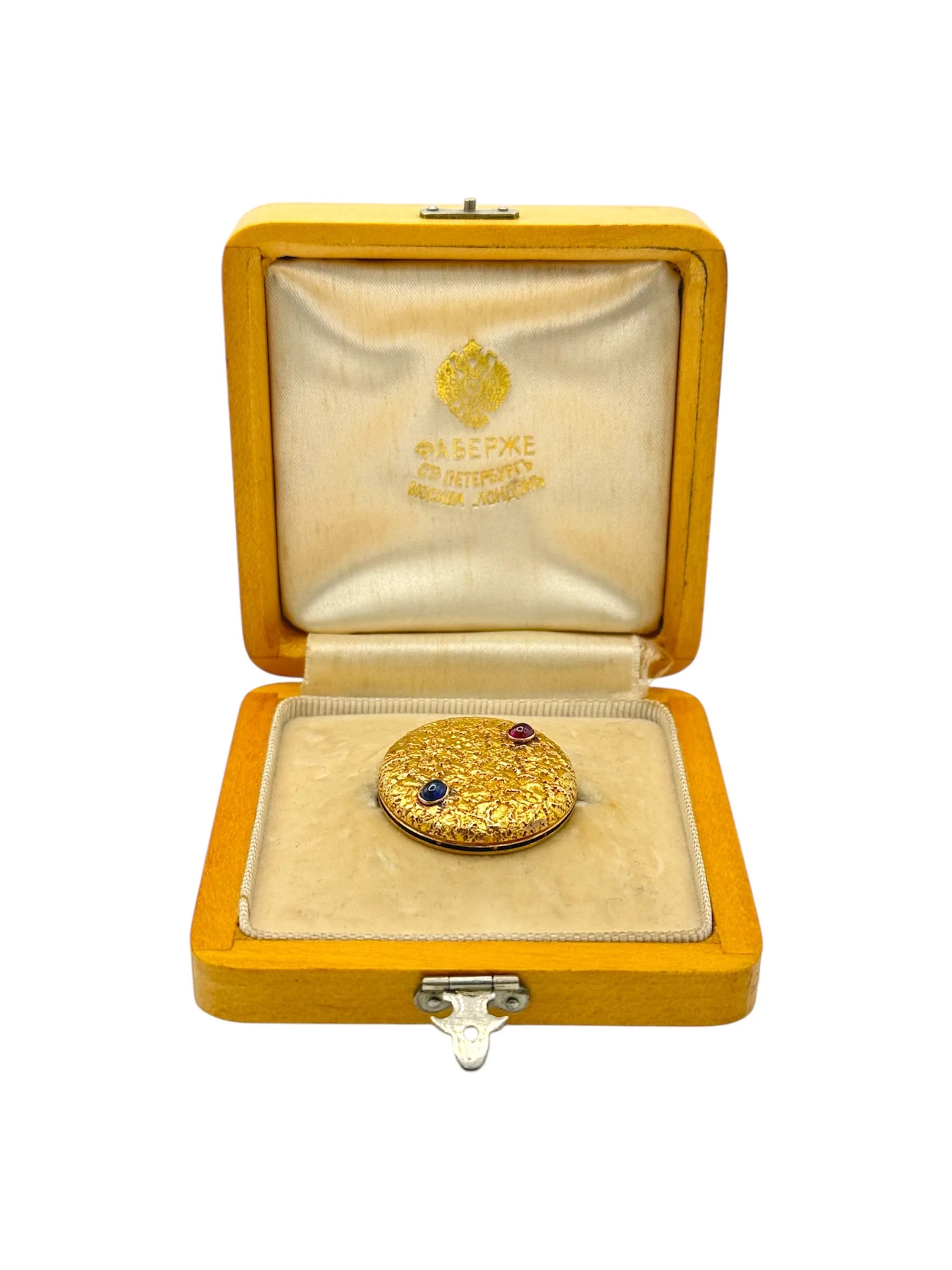 Russian gold brooch designed in samarodok style with sapphire and ruby cabochon, St Petersburg, c.1900.