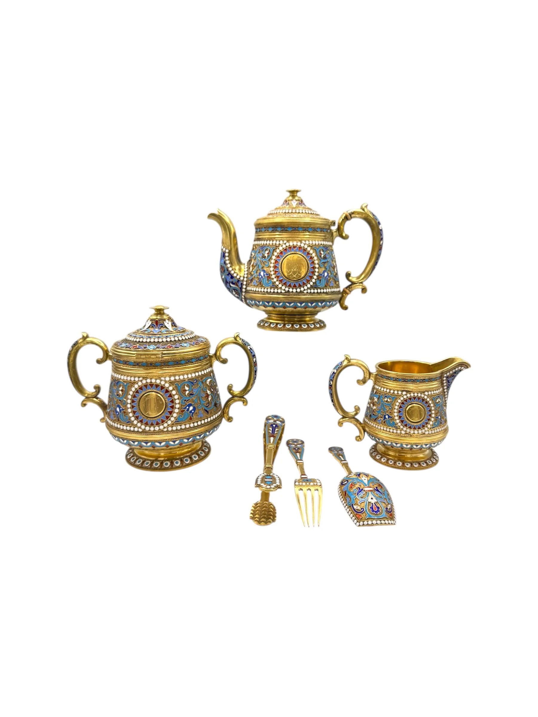 Russian silver gilt and cloisonné enamel three piece tea set with serving pieces, Moscow, 1880s by Nickolai Alexeyev.