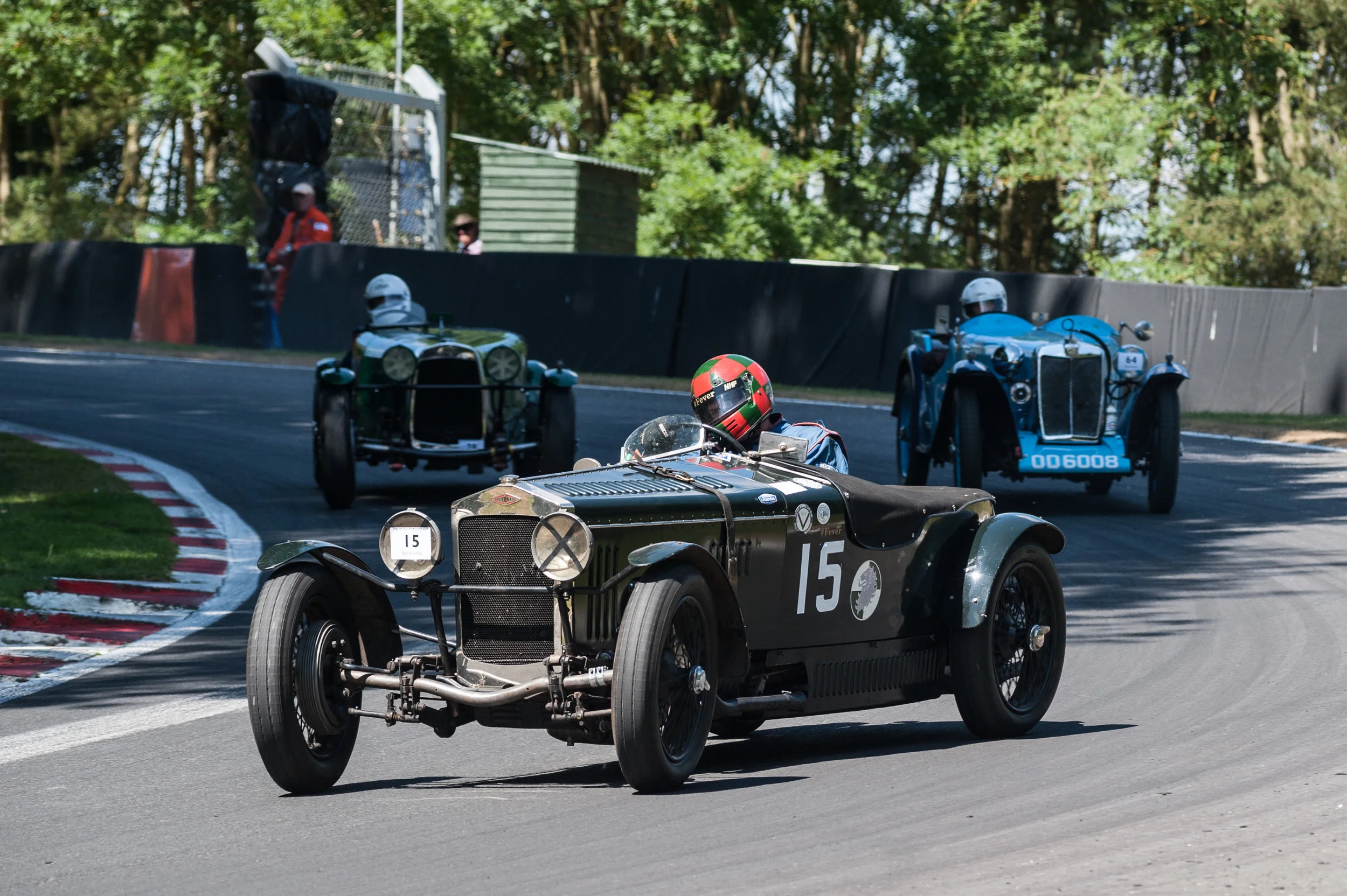Waterfield still ahead of eventual race winner Mahany as they pass Morland in the MG: Peter McFadyen