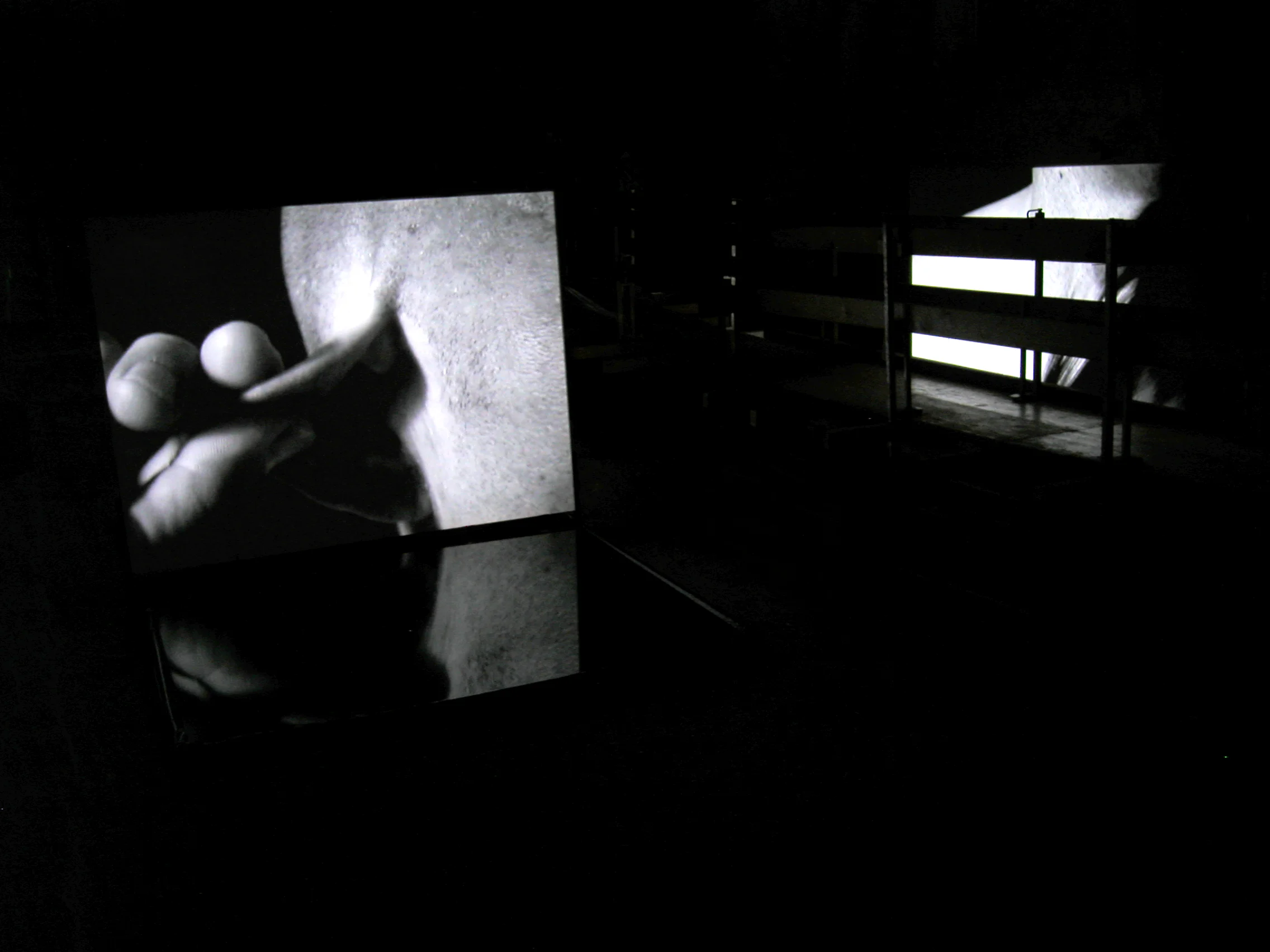 BODY OF GLASS - AFTER CARAVAGGIO, dual video and stereo audio and water installation, the Johanniterkirche, Feldkirch, Austria, 2006. Curator: Eva Jakob