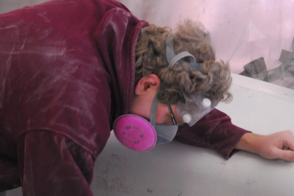 Team Member Nick Sloan hard at work sanding the mold.