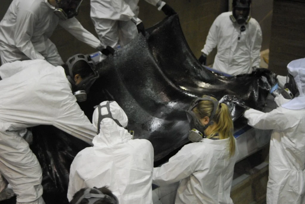 We lay the first ply of carbon on the shell of our new car, Eos.