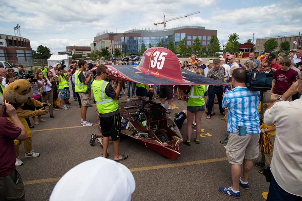 Centaurus III undergoes a post-race inspection as our supporters and the media croud around the car.