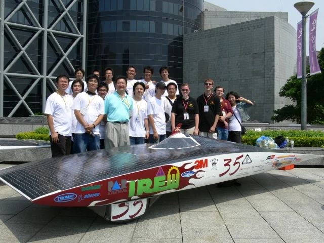 The scrutineering team poses with the car.