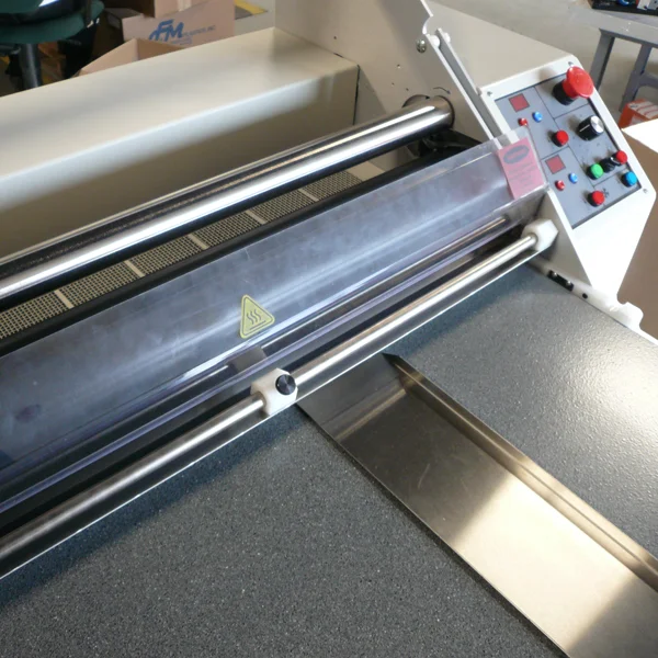 close up of rolling mechanisms in the laminating machine