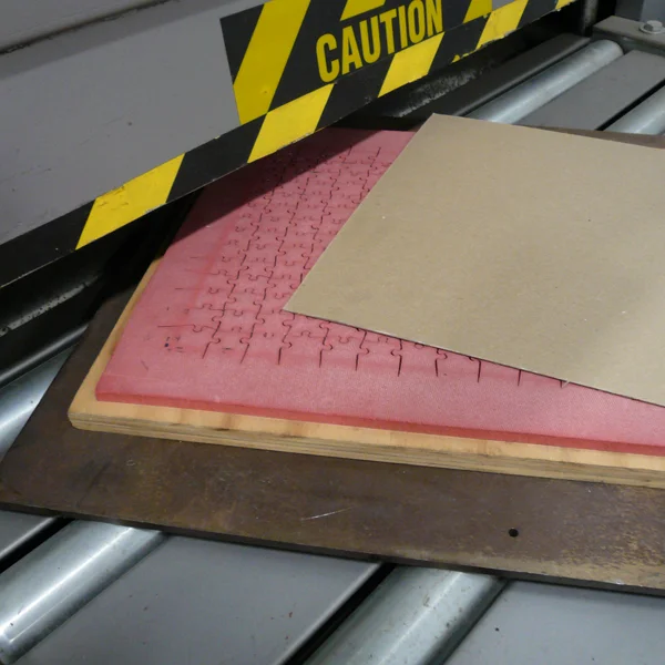 close up of a custom puzzle being die cut