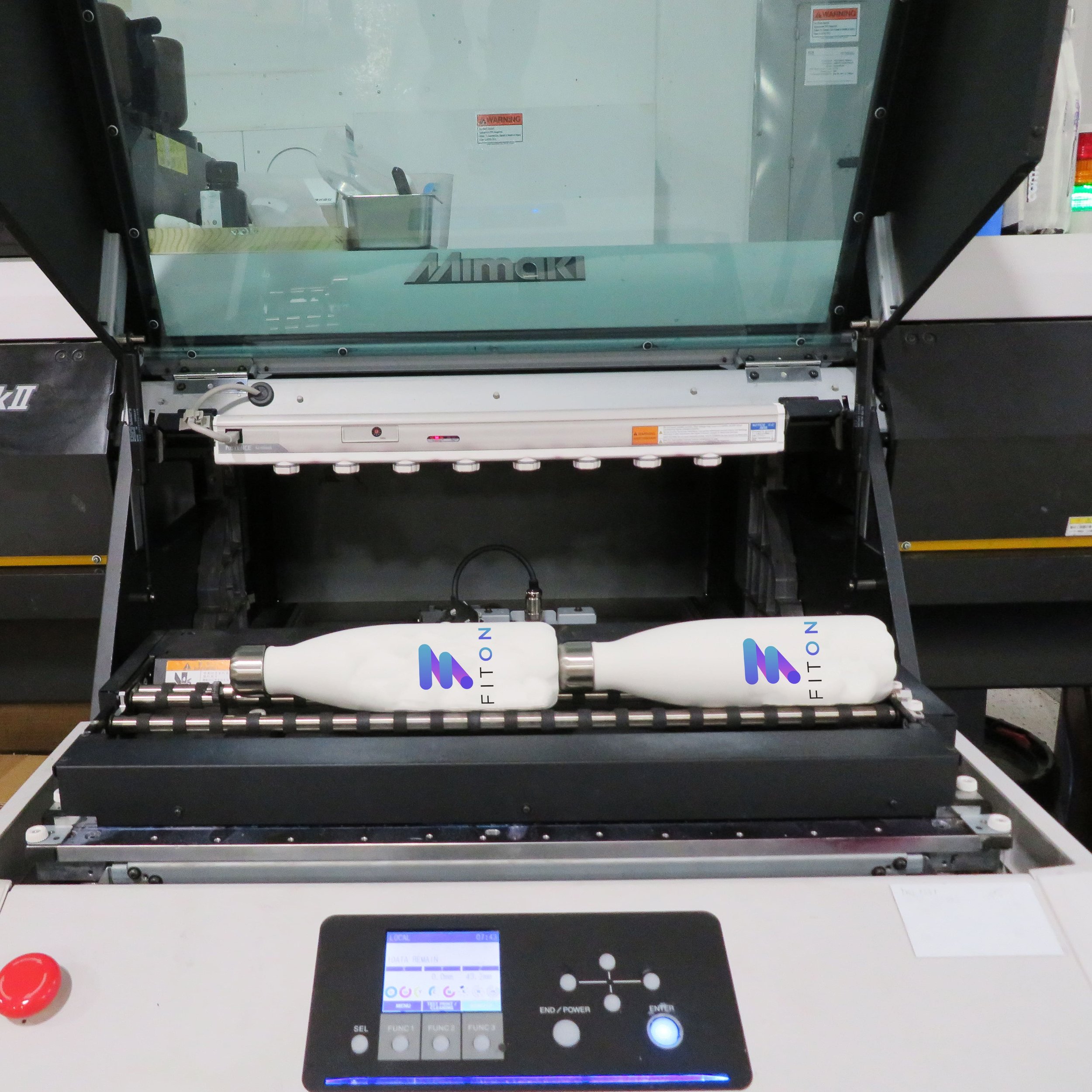 white water bottles being digitally printed