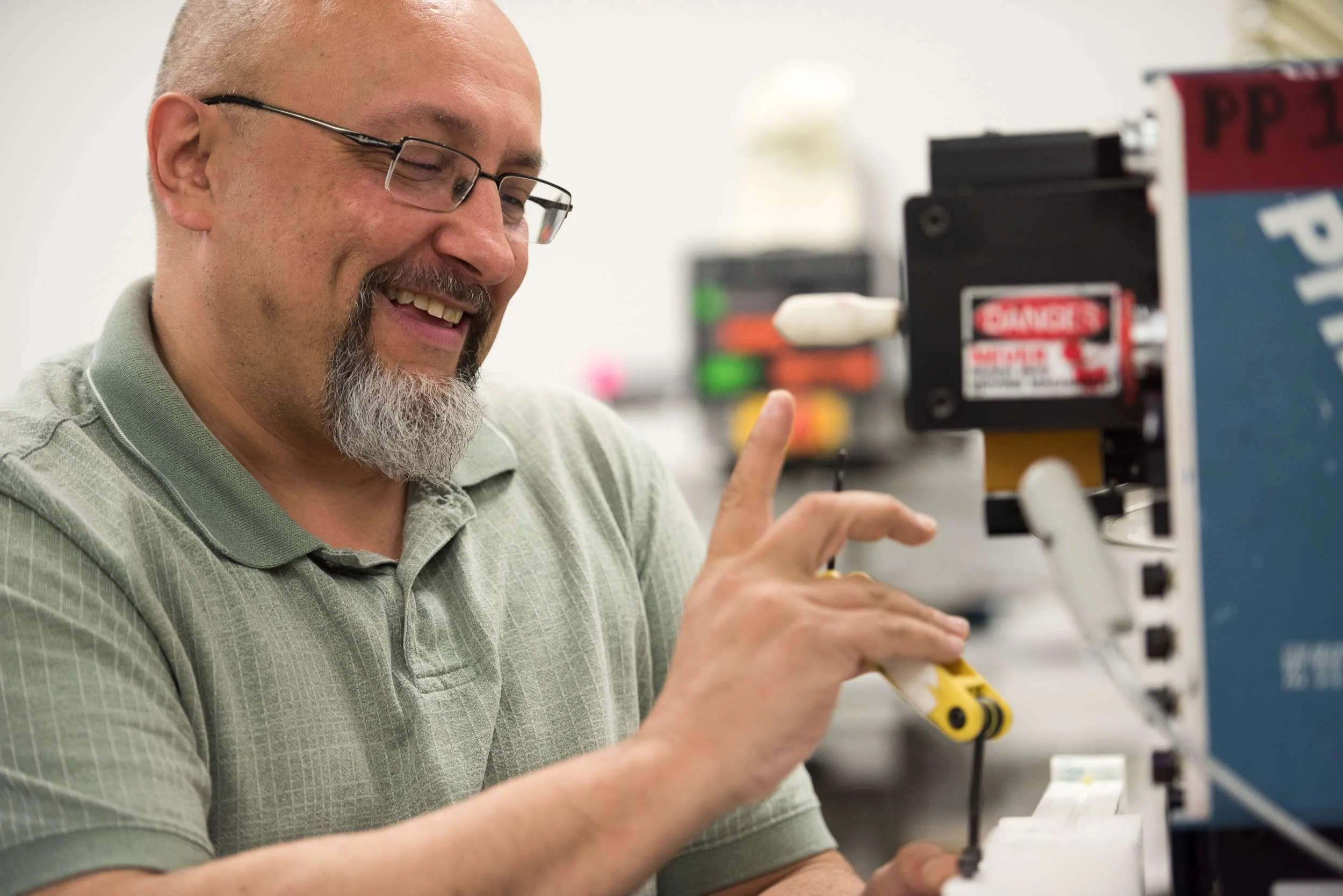 close up of a man with an allen wrench