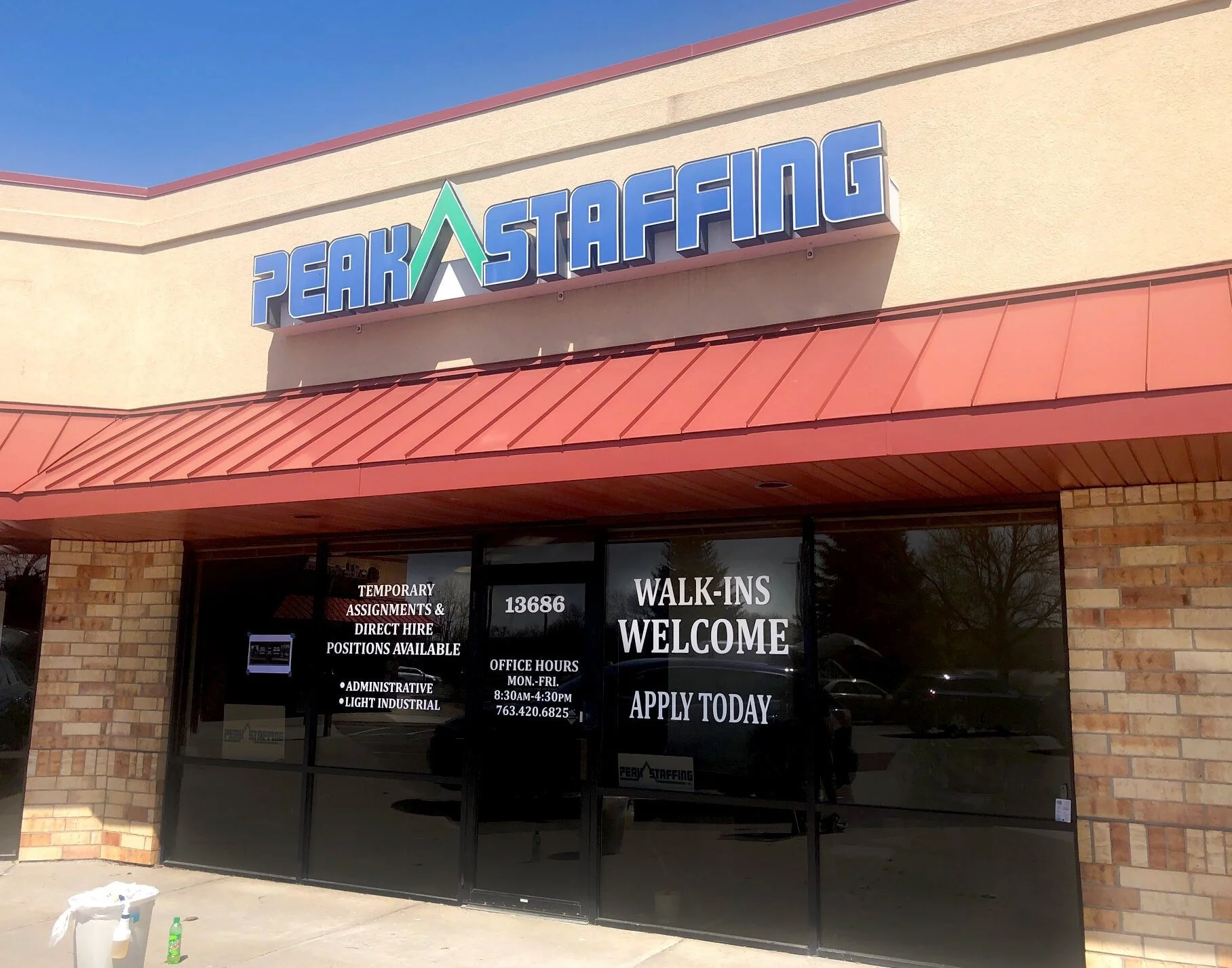 store front windows with completed installation of white vinyl