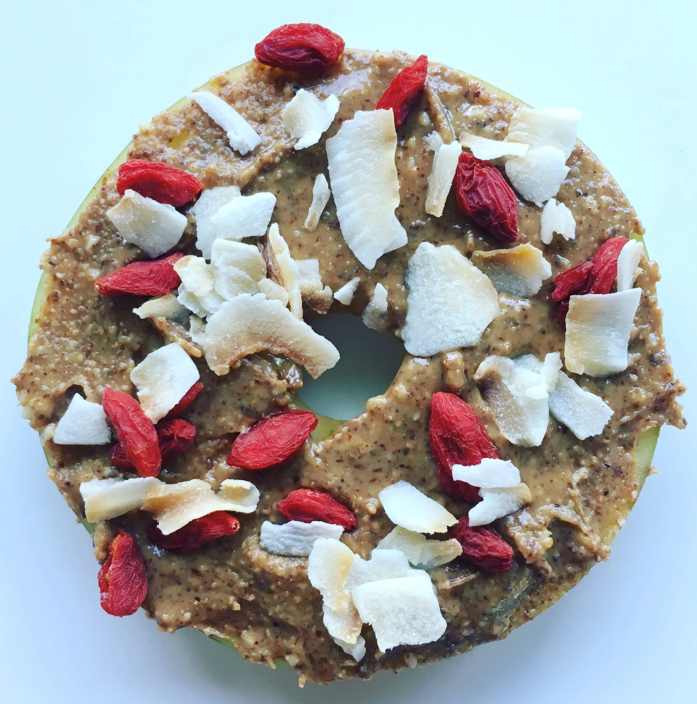 Honey Crisp Apple Disc with Sprouted Almond Butter, Goji Berries and Toasted Coconut