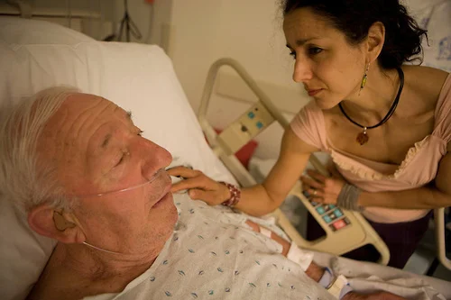 Julie Winokur keeps her father, Herb, company at St. Barnabas Medical Center in Livingston, N.J. Herb was admitted overnight due to his confusion from a recent fall.