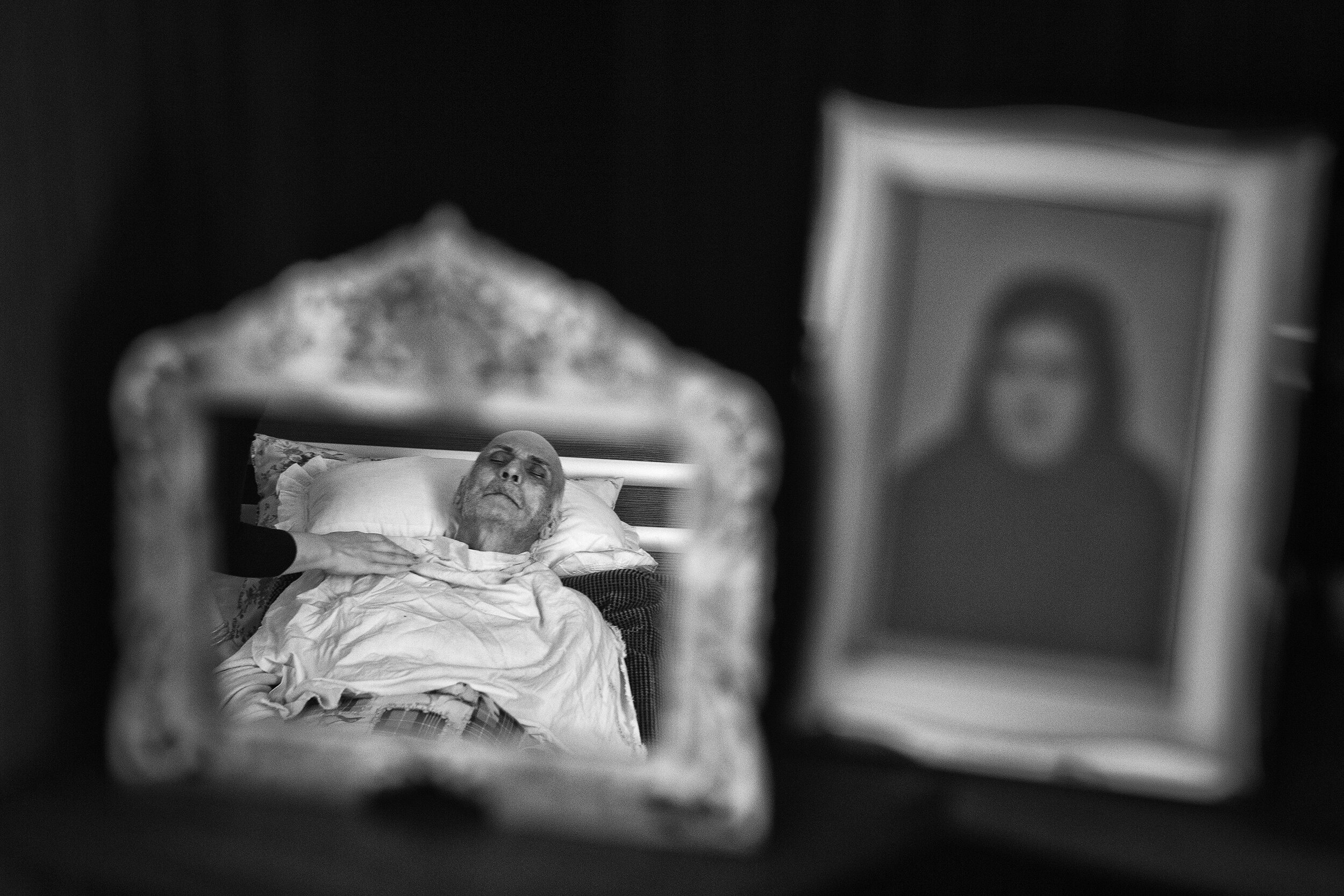  The picture of my father in the mirror beside the image of my grandmother.  A few hours after this picture was made, he died.  