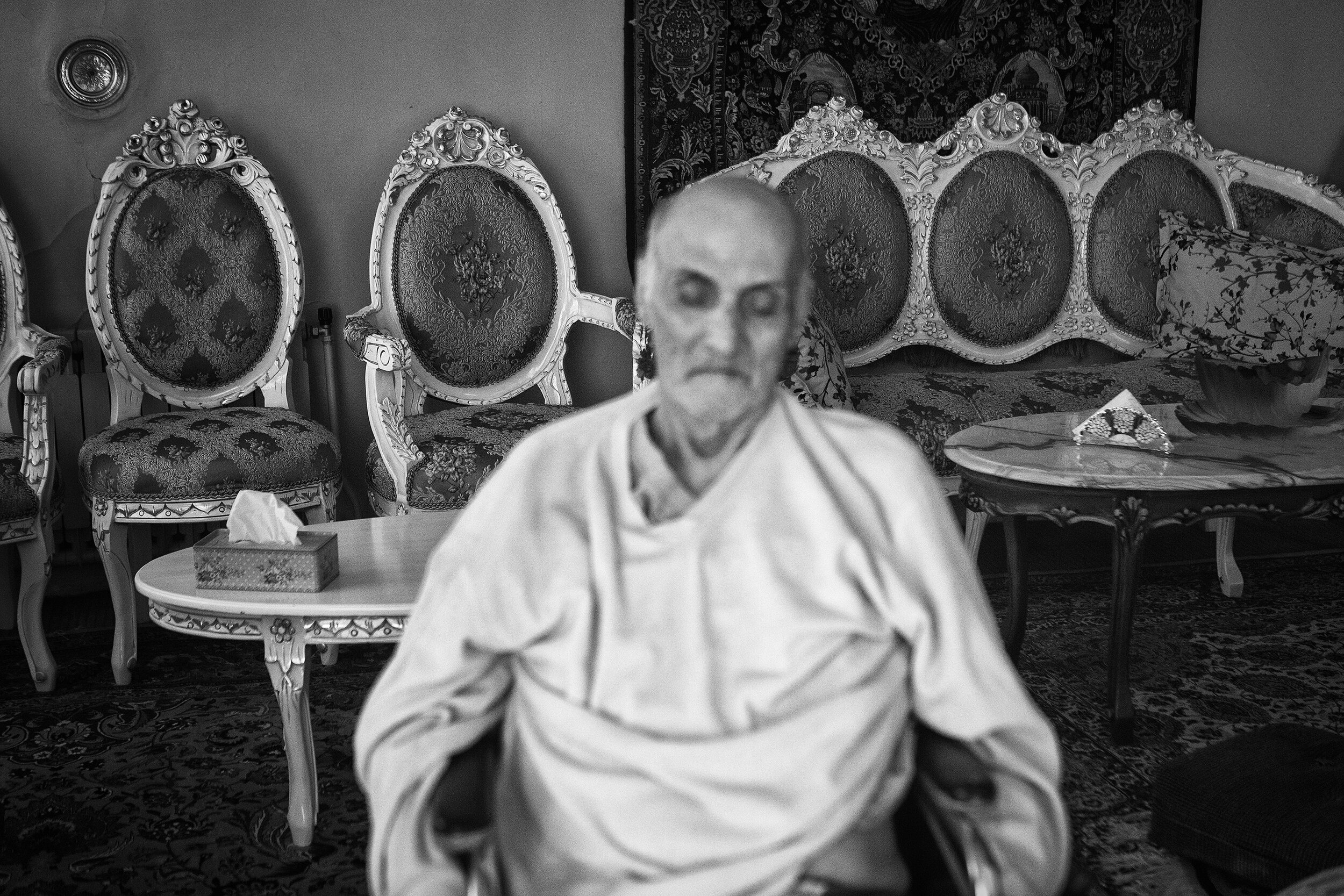  My father is sitting exhausted in the wheelchair in the early morning; waiting to make his bed after cleaning it.  