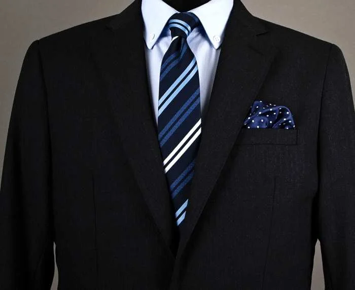 Note how the colors match of the pocket square match the tie, but not the pattern