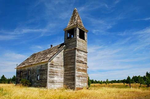 Figure 1. The Flora Methodist Church as built in 1896. Flora is located in northern Wallowa County at 4,350-feet elevation. It was platted in 1897 and by 1910 had 200 residents. In 1918, an eight-room school was built. The Post Office operated from 1890 to 1966. A ghost town, Flora is considered “the most substantial town to fail” in Northeast Oregon. Source: Gary Halvorson, Oregon State Archives (image) and Wikipedia (text)