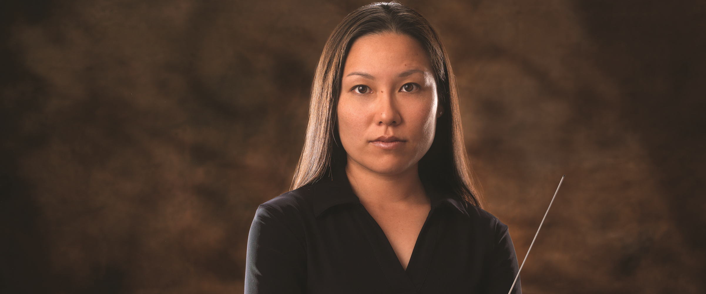 A versatile conductor, Kayoko Dan is active in the fields of orchestra, ballet, and opera. Ms. Dan began her tenure as the 8th Music Director of the Chattanooga Symphony and Opera in the 2011-2012 season. Previously, she served as Assistant Conductor of the Phoenix Symphony and Music Director of Central Kentucky Youth Orchestras. She has been awarded the Karajan Fellowship for Young Conductors, as well as the David Effron Conducting Fellowship at the Chautauqua Institute. Ms. Dan has participated in numerous workshops including the Kurt Masur Conducting Seminar, International Bartok Festival, Fondazione I Pomeriggi Musicali Conducting Workshop and National Conducting Institute. As a strong advocate of music education, Ms. Dan is in demand as a clinician at universities, high schools, youth orchestras, and regional orchestras throughout the country. She has taught at several elementary schools including Thomas J. Pappas school for homeless children in Arizona as an ArtsBridge Scholar. While serving as a Graduate Teaching Assistant, her dedication and passion for music education was recognized by Graduate Teaching Excellence Award from the Arizona State University. Additionally, she is a frequent guest speaker at university conducting classes to encourage young conductors who are pursuing a career in music. Ms. Dan began her musical training in Japan at age three. After relocating to the United States, she continued her musical studies with flute and received a Bachelor in Music Education at the University of Texas, and her Doctor of Musical Arts in Conducting and Master in Music Education from Arizona State University. Her principal teachers are Timothy Russell and Timothy Muffitt. She has also studied with Kurt Masur, Leonard Slatkin, Zoltan Pesko, Jorma Panula and William Reber. kayokodan.com