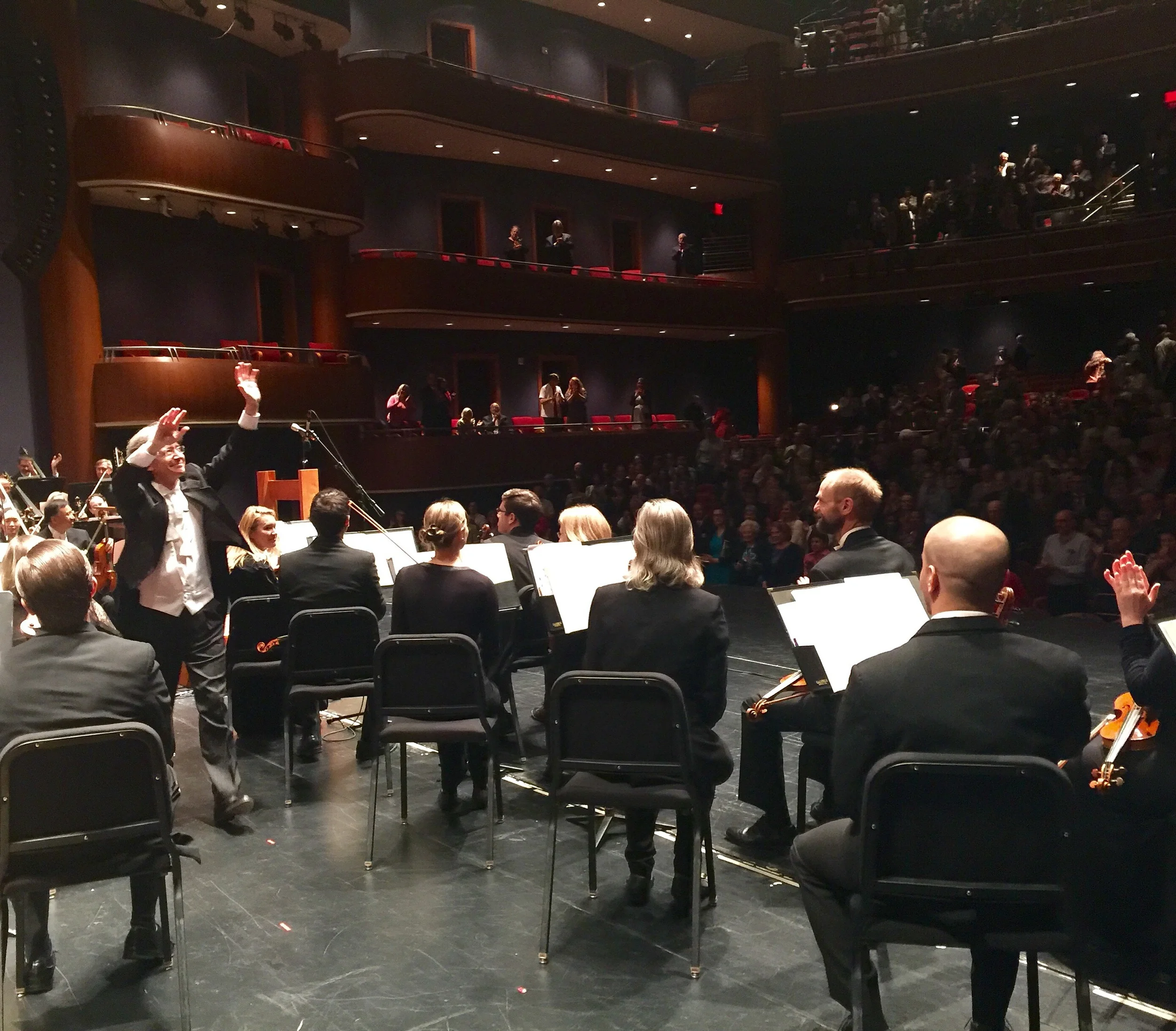 Maestro Grant Cooper responding to the standing ovation from the crowd on May 7, 2016 at the end of the performance. 