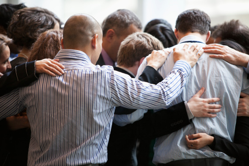 Praying for one another.jpg