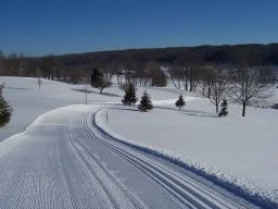 Groomed trail with blue skies at Byrncliff Resort & Conference Center