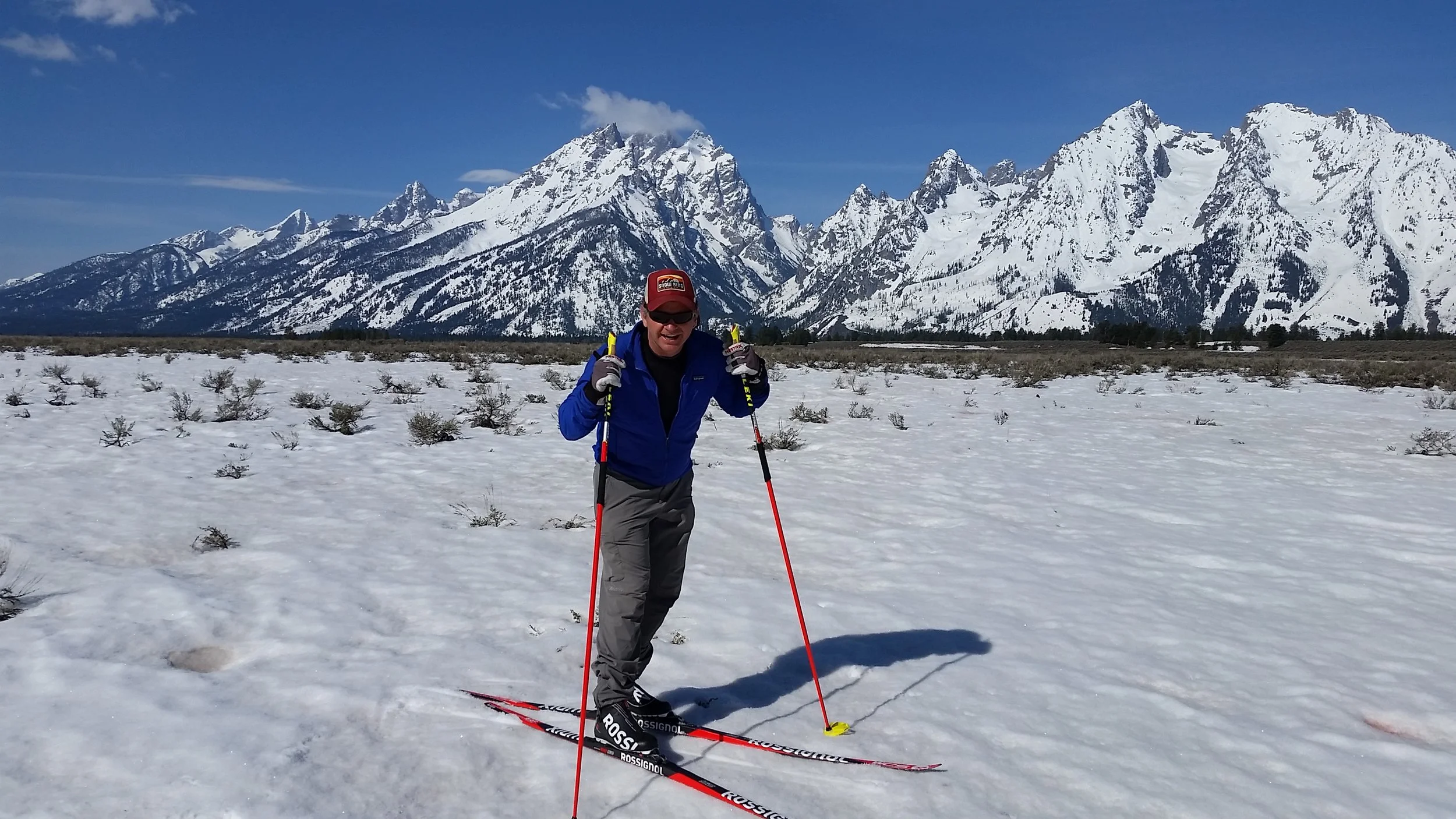 Scot McGee, ski pro posing in the sunshine under the Grand Tetons