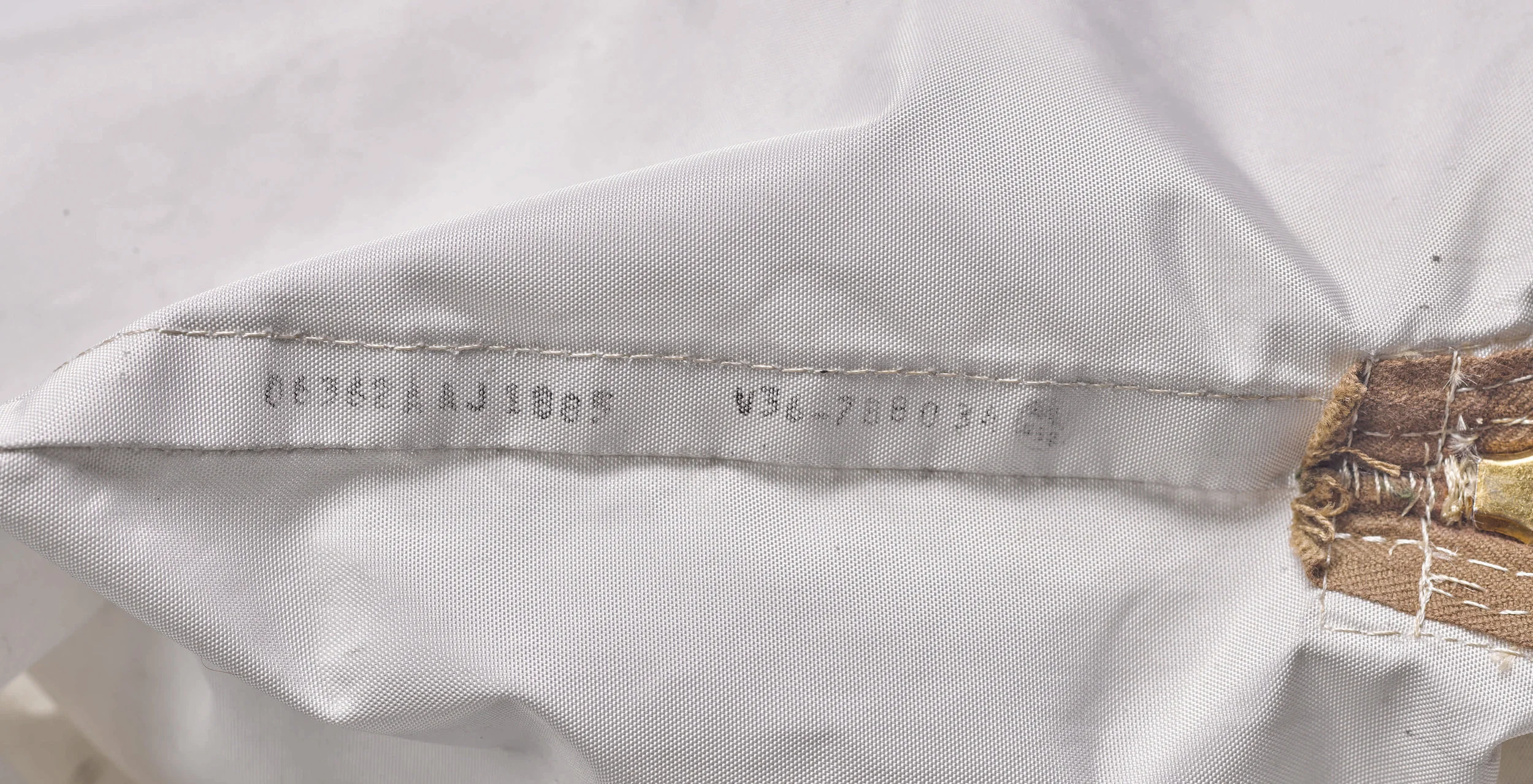 The unique serial stamped inside the original Lunar Sample Return bag. Serial reads as: 0632AAJ1885 V36-788034