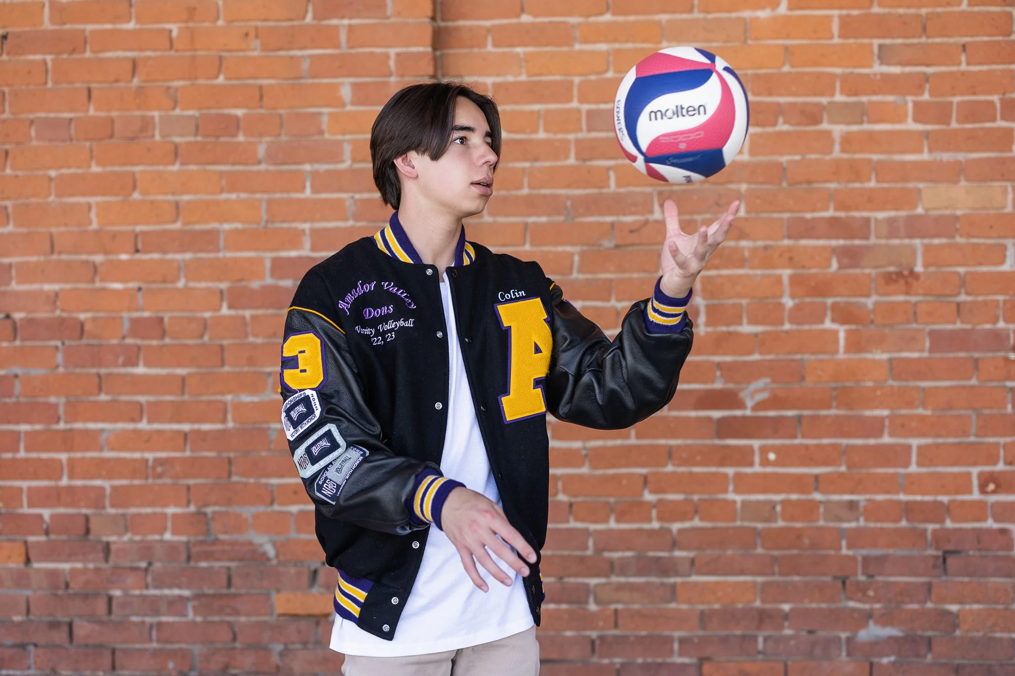 senior-pictures- guy-downtown-sacramento-letterman-jacket.jpg
