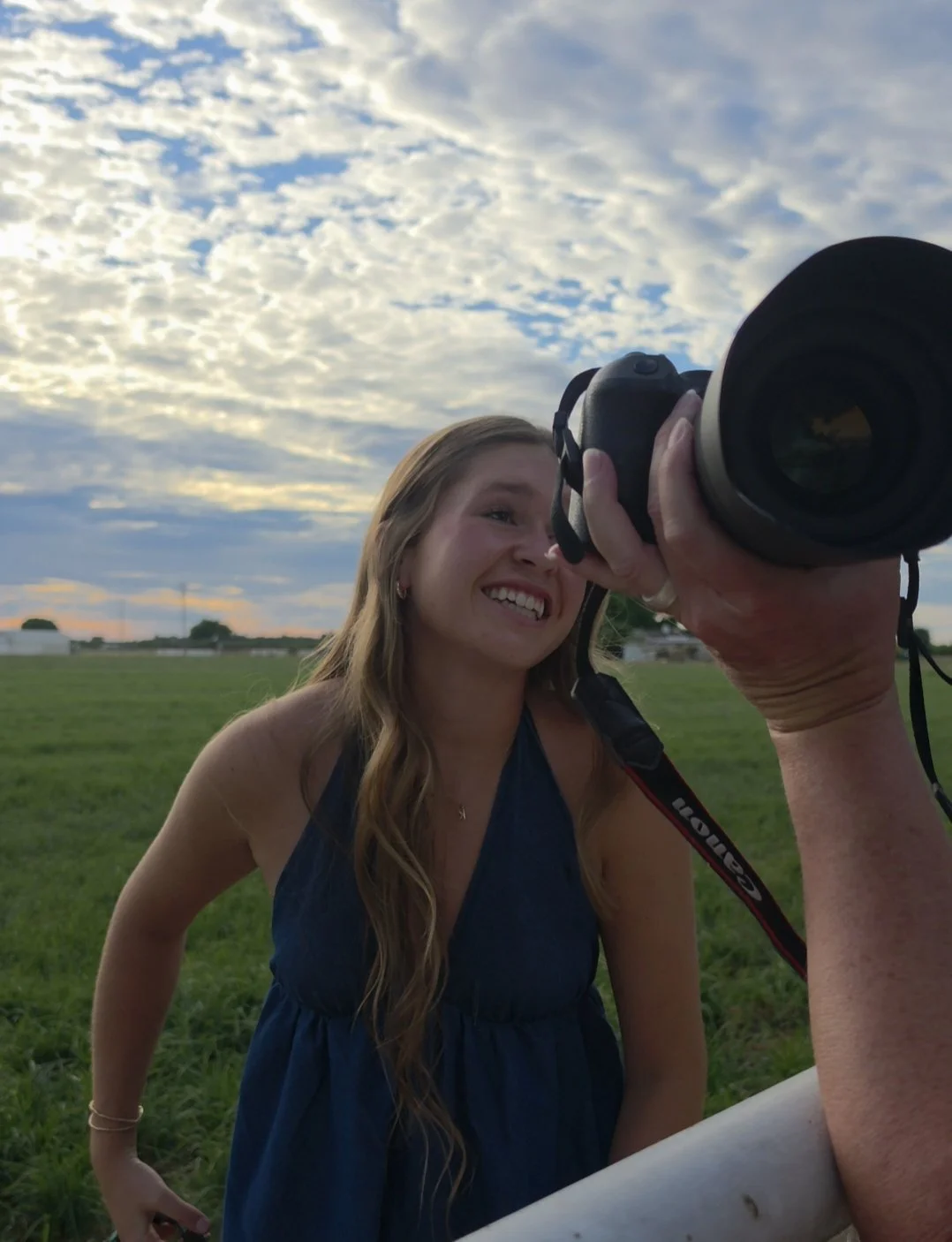 ehind-the-scenes senior pictures for a Liberty Ranch High School senior smiling during her outdoor portrait session at her family ranch near Lodi, California.