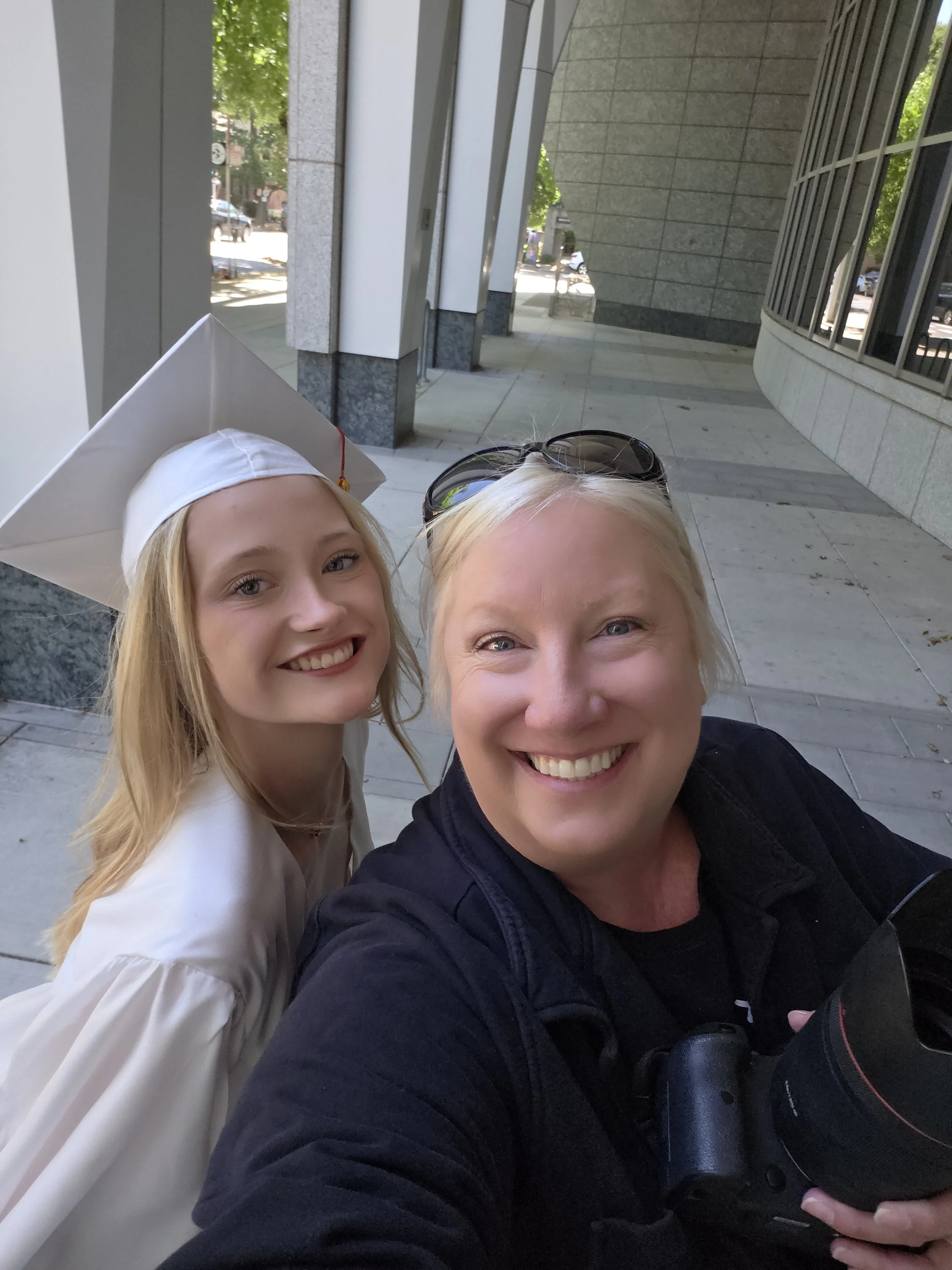 Takinga selfie during cap and gown grad pictures