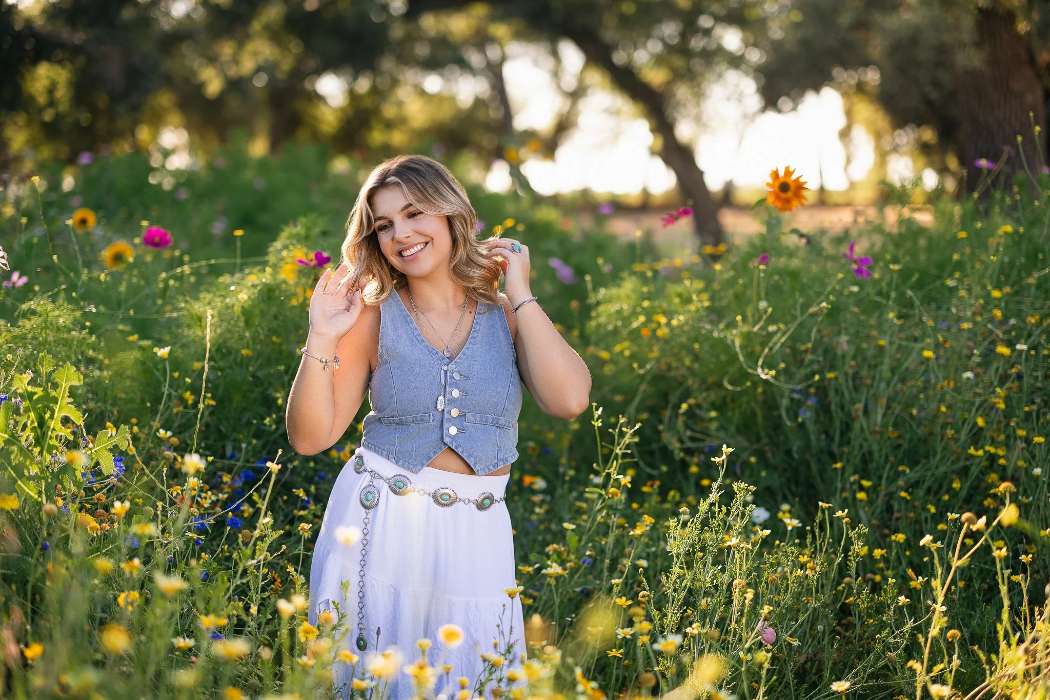 Senior pictures of a girl in a summer flower field at a flower farm just outside of Sacramento